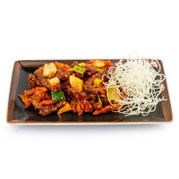 Crispy beef with potatoes in hot sauce